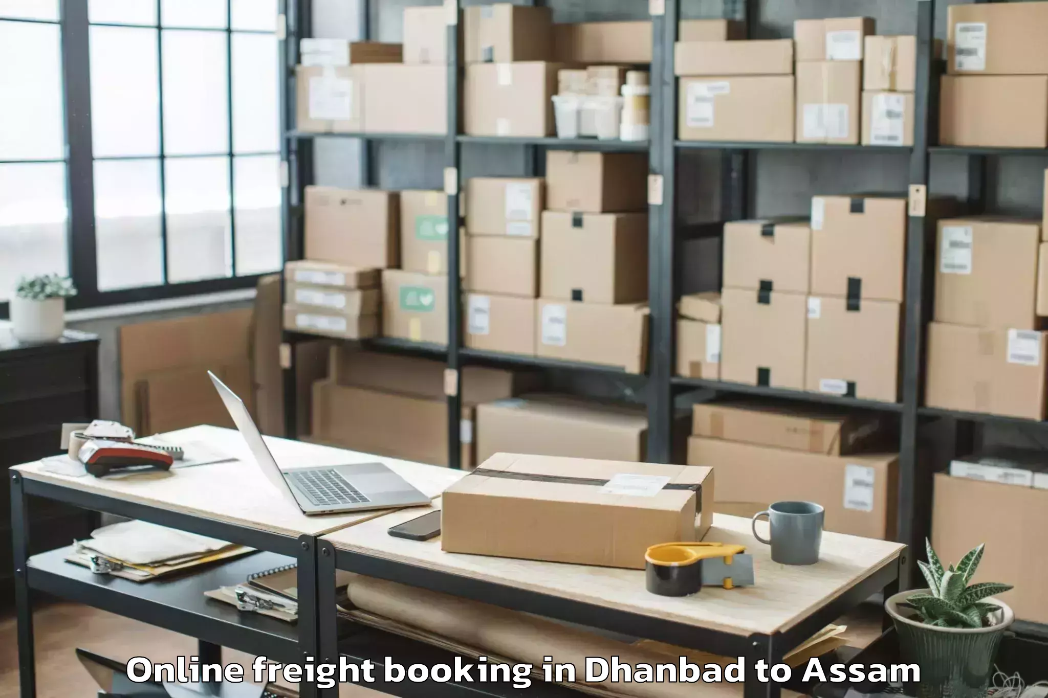 Professional Dhanbad to Pathorighat Pt Online Freight Booking